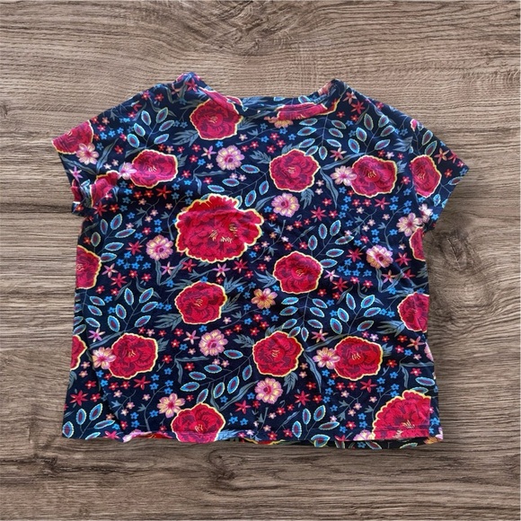 short-sleeved t-shirt with an all-over floral print. The shirt features - Picture 1 of 14